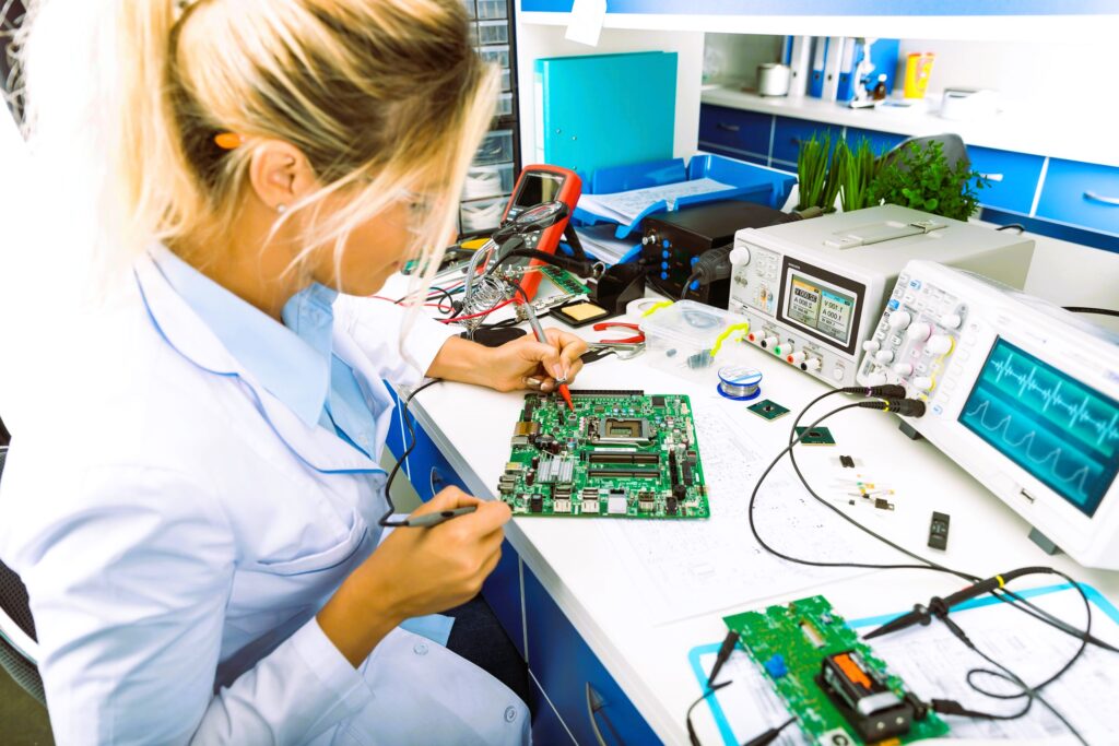 The girl conducts a microcircuit test
